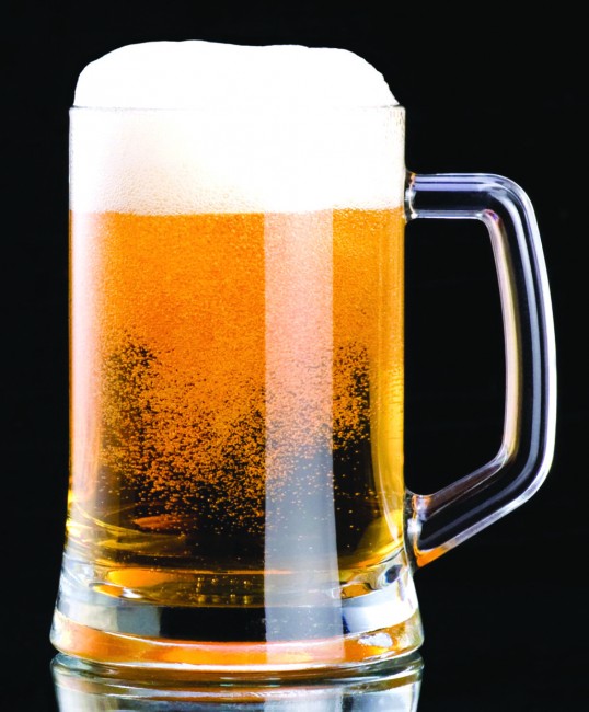 Mug fresh beer with cap of foam on a black background; Shutterstock ID 125482709; PO: aol; Job: production; Client: drone